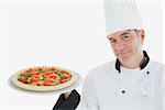 Portrait of happy chef holding delicious pizza over white background