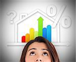 Woman looking up at energy efficient house graphic with question and percentage marks