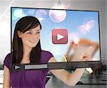 Smiling woman using video on touch screen against background
