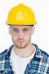 Closeup portrait of architect wearing protective eyewear and hardhat over white background