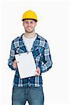 Portrait of smiling young male architect holding clipboard over white background