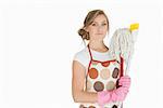 Portrait of young woman with cleaning supplies over white background