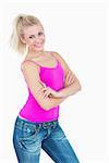 Portrait of happy casual young woman with arms crossed over white background