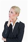 Thoughtful young business woman looking away over white background