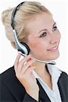 Closeup portrait of young business woman wearing headset over white background