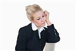 Serious young business woman in thought over white background