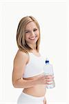 Portrait of happy young woman with water bottle over white background