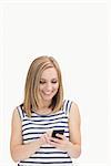 Casual young woman with smartphone over white background