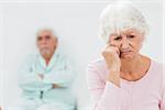 Elderly couple having a dispute in bedroom