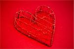 Heart shaped ornament box on red background