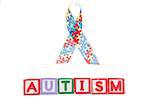 Autism awareness ribbon above letter blocks spelling autism on white background