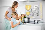 Mother and daughter making dinner using futuristic interface in the kitchen