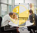 Business people using yellow pie chart interface during presentation