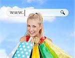 Happy blonde with her shopping bags under address bar on blue sky background