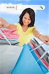 Woman showing her shopping bags under address bar on blue sky background