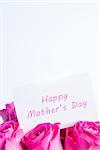 Bouquet of pink roses with happy mothers day card in pink on white background