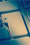 Enter key on keyboard in close up in blue