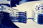 Close up of hard disk drive in blue tint of computer