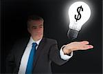 Businessman showing light bulb with dollar symbol