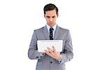 Businessman holding a tablet computer on white background