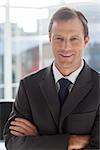 Businessman with arms folded in an office