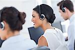 Three call centre employees working in line