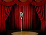 Retro microphone and red curtain on a stage with spotlight