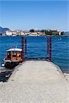 Small boat in front of Isola Bella, the most beautiful of the three Isles of Lago Maggiore, Italy