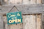 Vintage open sign on old wooden door