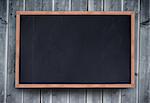 Blackboard with copy space on wooden board background