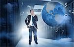 Businessman standing and thinking in data center with currency graphics and earth
