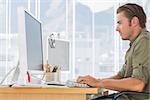 Creative business employee working on computer in a modern office