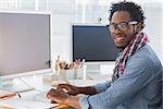 Portrait on a creative business worker on computer in a modern office