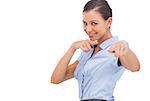 Smiling businesswoman pointing out with fingers