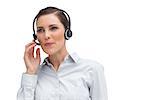 Businesswoman working with headset on a white background