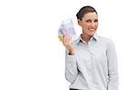 Happy businesswoman showing lots of money on white background