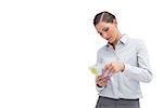 Businesswoman counting her money on white background