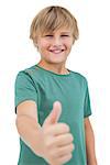 Happy little boy giving thumbs up white background