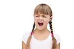 Furious little girl with eyes closed on white background
