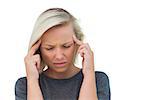 Attractive woman having a headache on white background