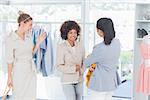 Cheerful woman wearing a blazer in a creative office