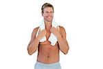 Shirtless man standing with a towel around his neck on white background