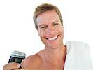 Cheerful man holding an electric razor on white background