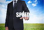 Businessman selecting speed word with landscape on the background