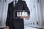 Businessman in a data center selecting label with lead written on it