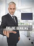 Businessman touching the term online banking in his office