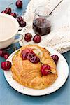 breakfast with  fresh croissants and  chery berries