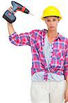 Blonde handy woman holding a power drill on white background