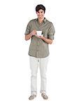 Happy man holding cup of coffee on a white background