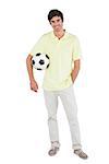 Smiling  man holding soccer ball on a white background